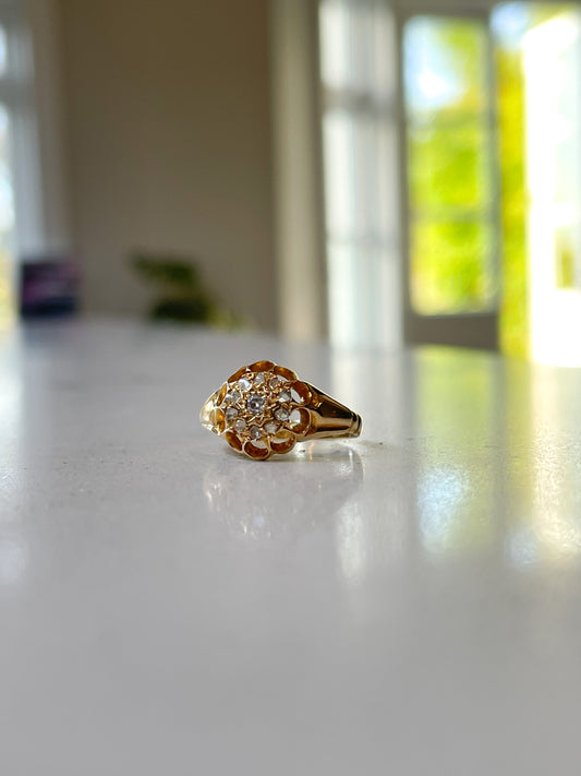 Antique diamond starburst halo ring on 18ct gold