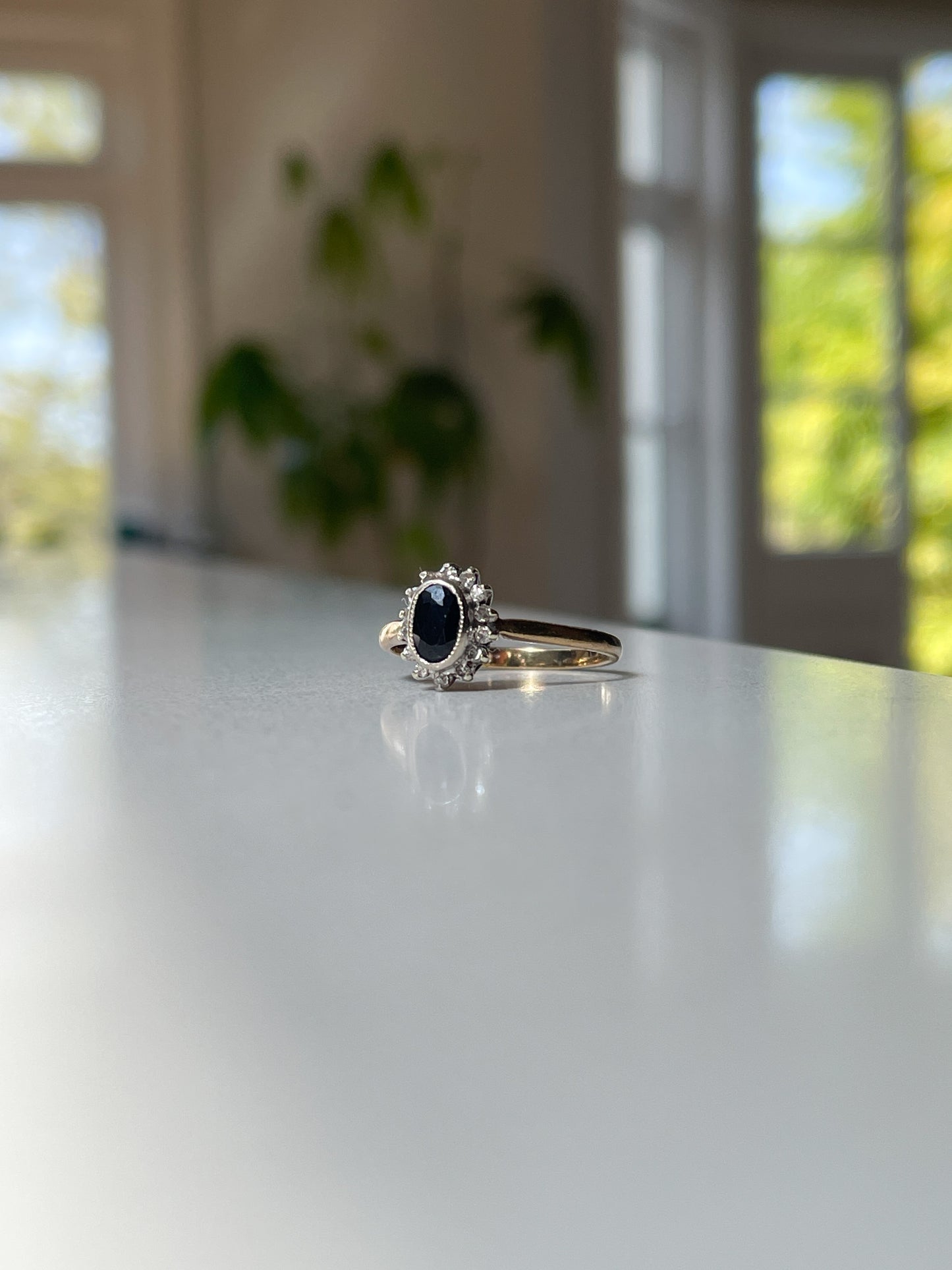 Vintage sapphire and diamond halo cluster ring on 9ct gold