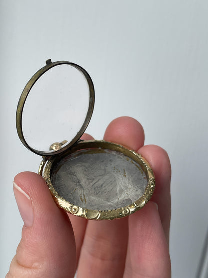 Antique mourning locket with glass cover