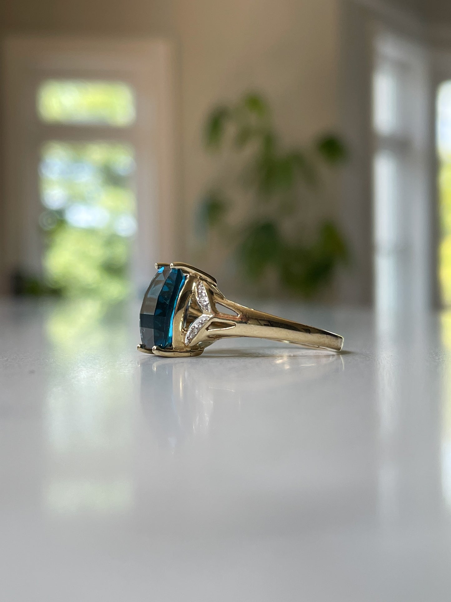 Contemporary blue topaz and diamond cocktail ring on 9ct gold