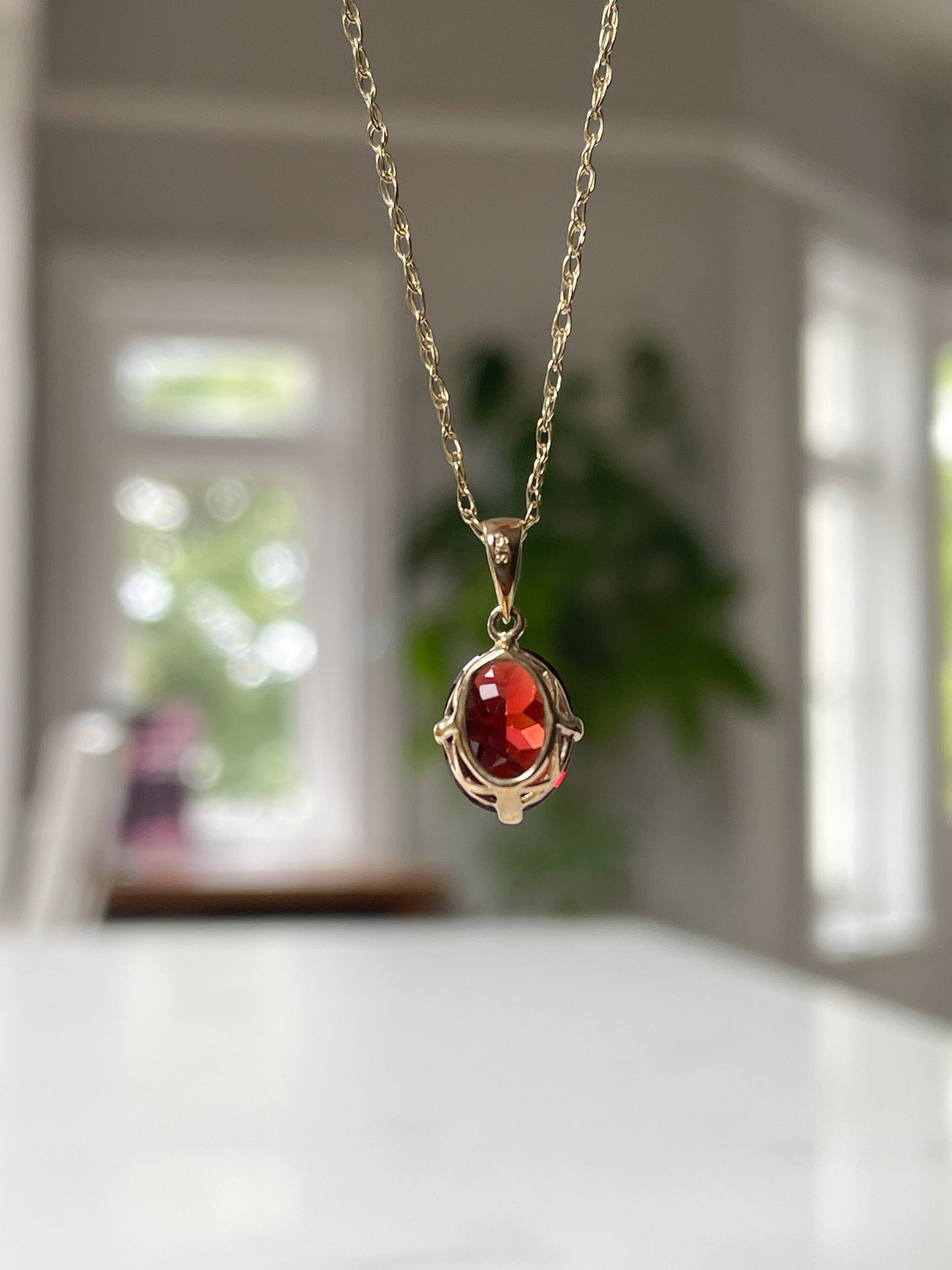 Contemporary garnet necklace pendant on 9ct gold with chain