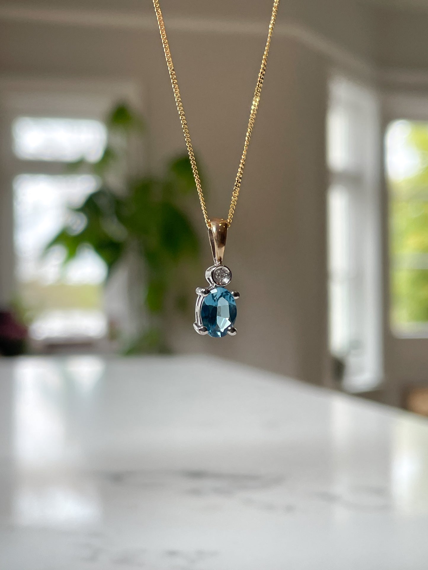 Blue topaz and diamond necklace