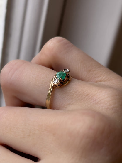 A vintage emerald and diamond trilogy ring on 9ct gold