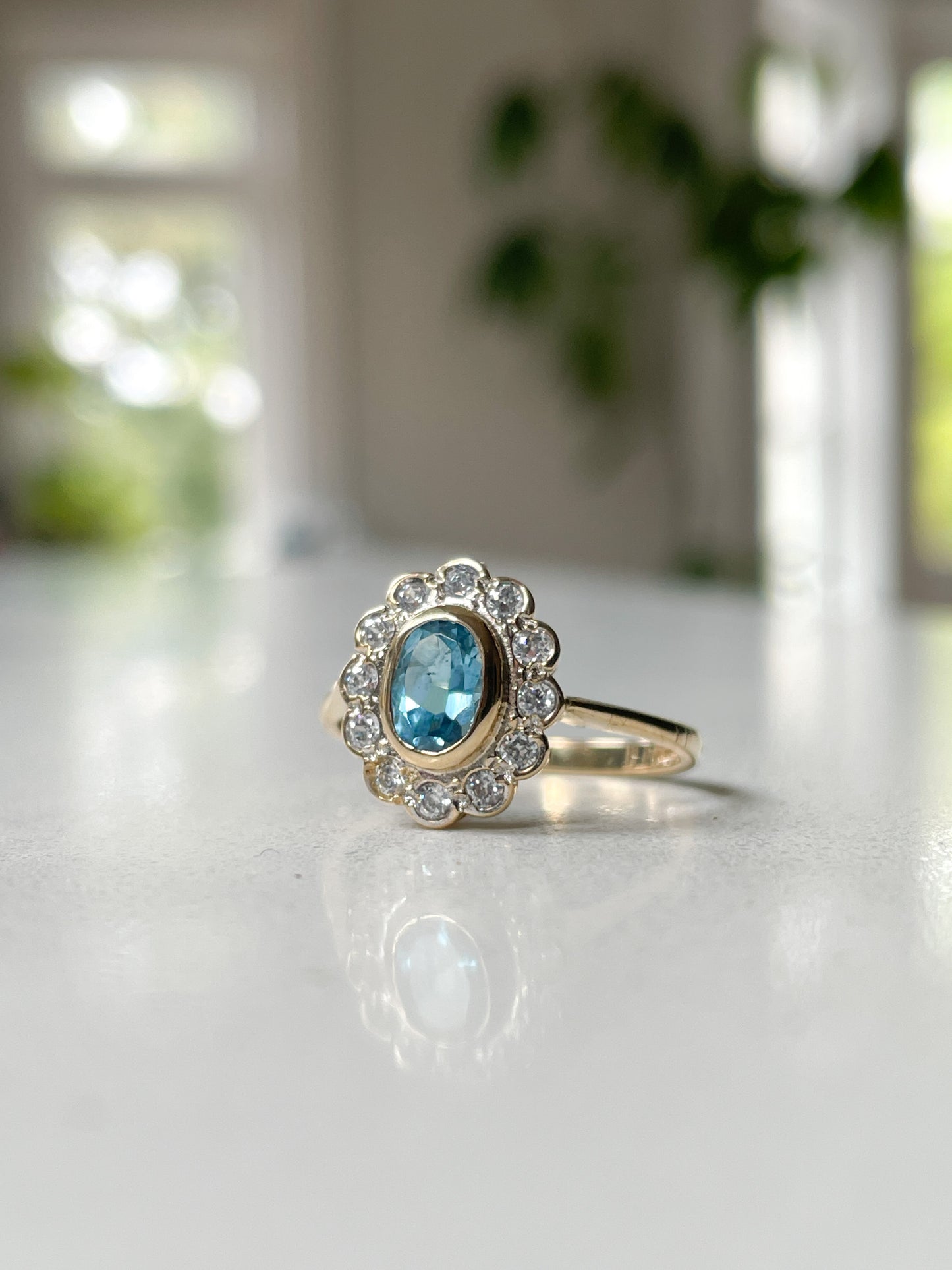 Blue topaz cluster ring on 9ct gold