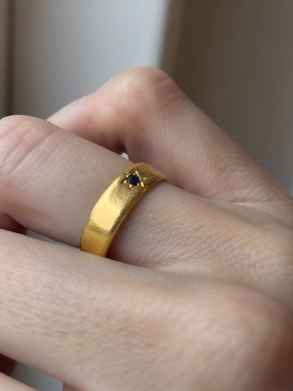 A vintage 22ct gold star set sapphire ring