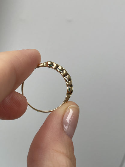 Vintage diamond and emerald 7-stone half eternity ring