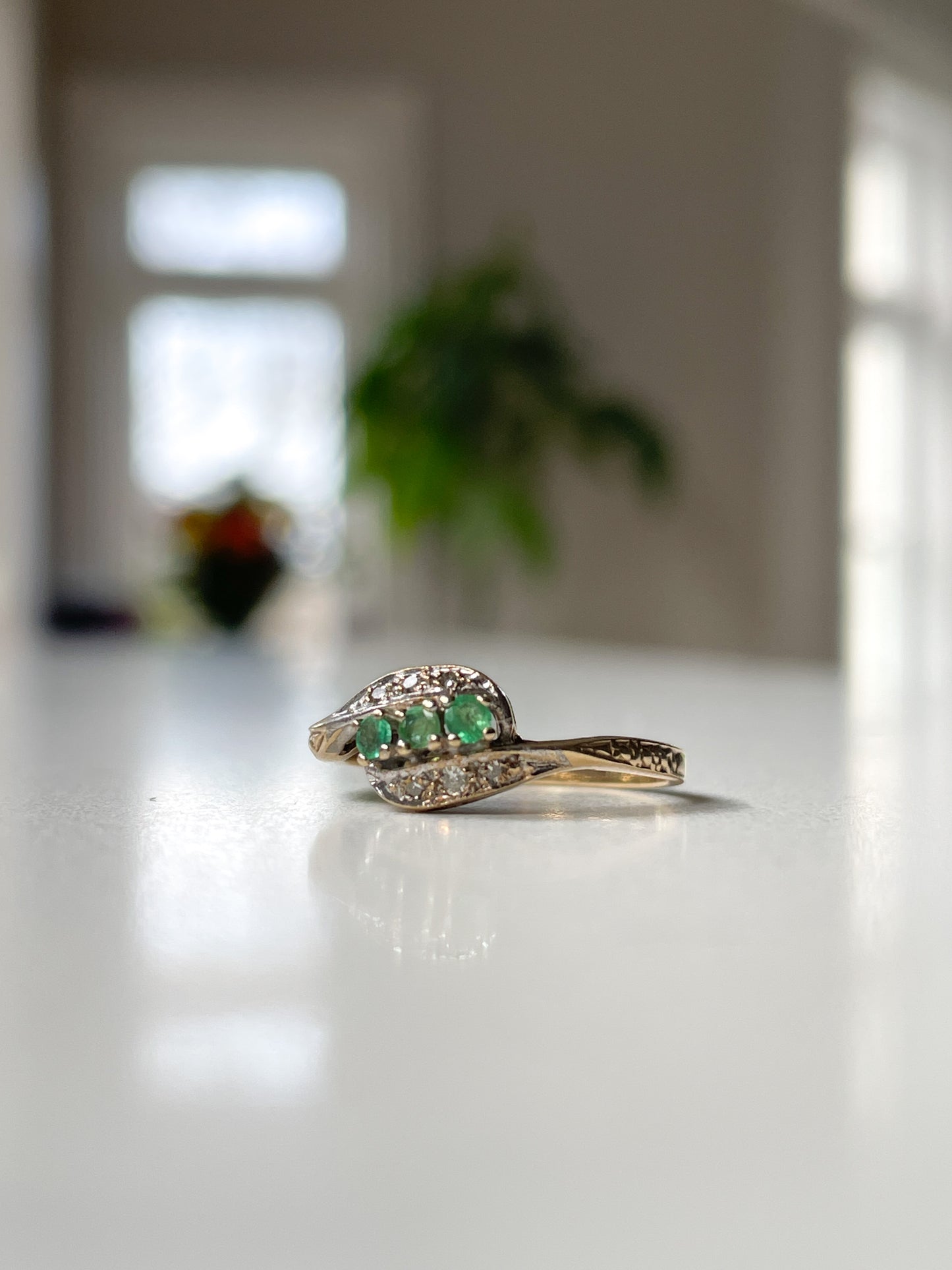 9ct gold emerald and diamond bypass ring from 1982
