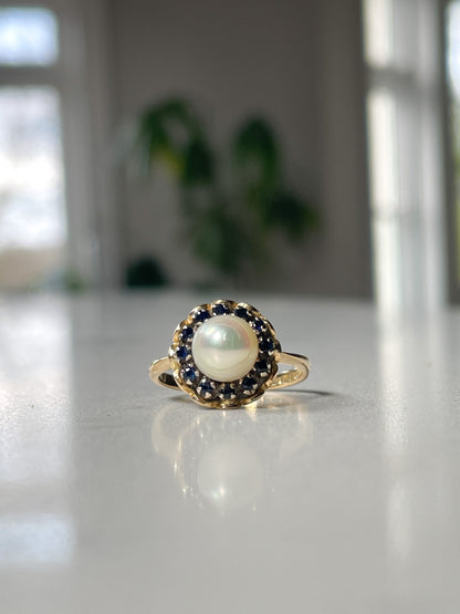 1960s Pearl and sapphire halo ring on 18ct gold