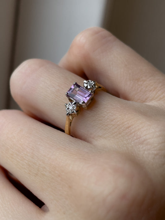 A vintage amethyst and diamond trilogy ring on 9ct gold