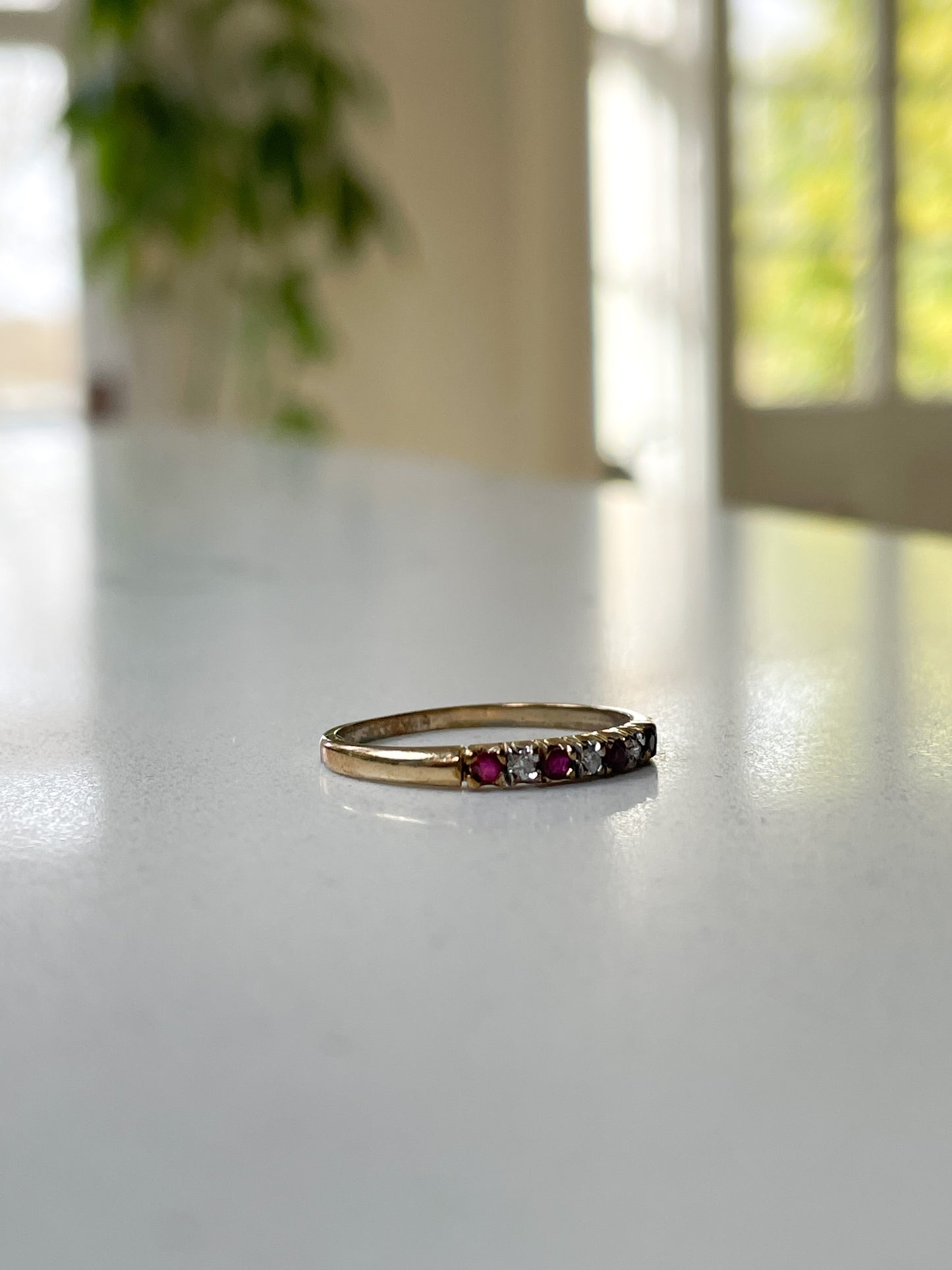 Vintage garnet and diamond half eternity ring