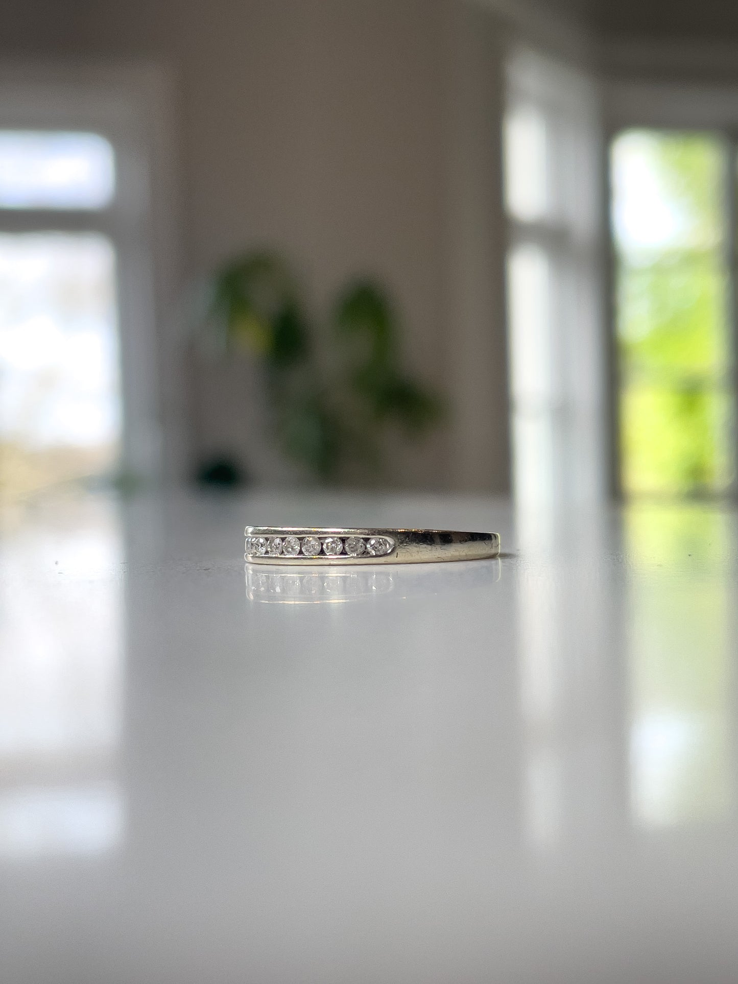Vintage channel set diamond half eternity ring on 9ct white gold