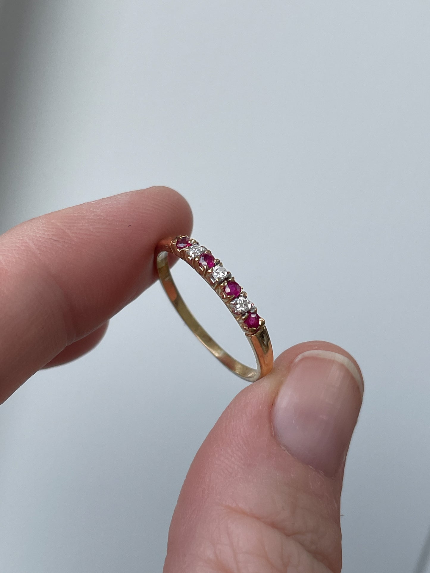 Vintage garnet and diamond half eternity ring