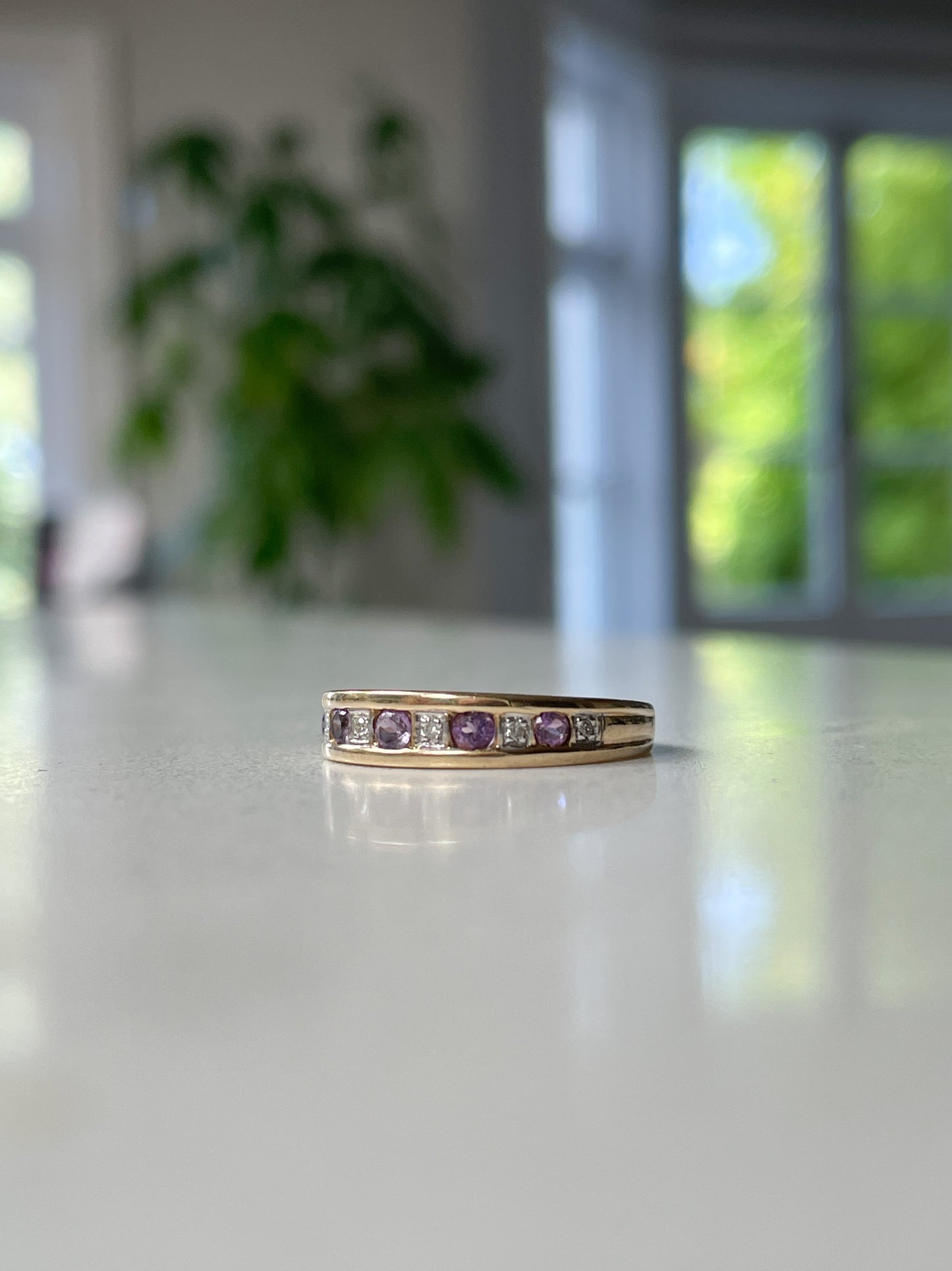 Vintage amethyst and diamond half eternity ring on 9ct gold
