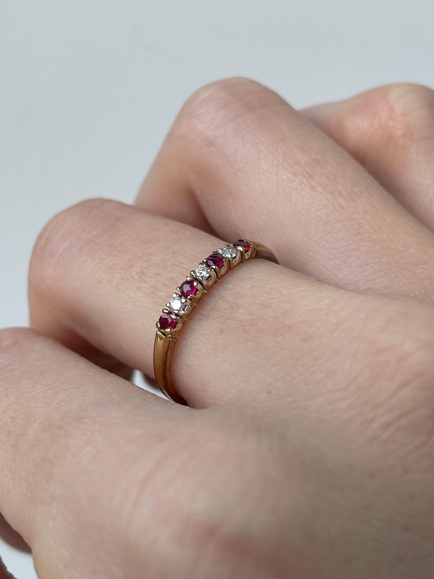 Vintage garnet and diamond half eternity ring