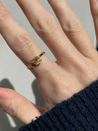 Antique gold hand and emerald ring on 18ct gold