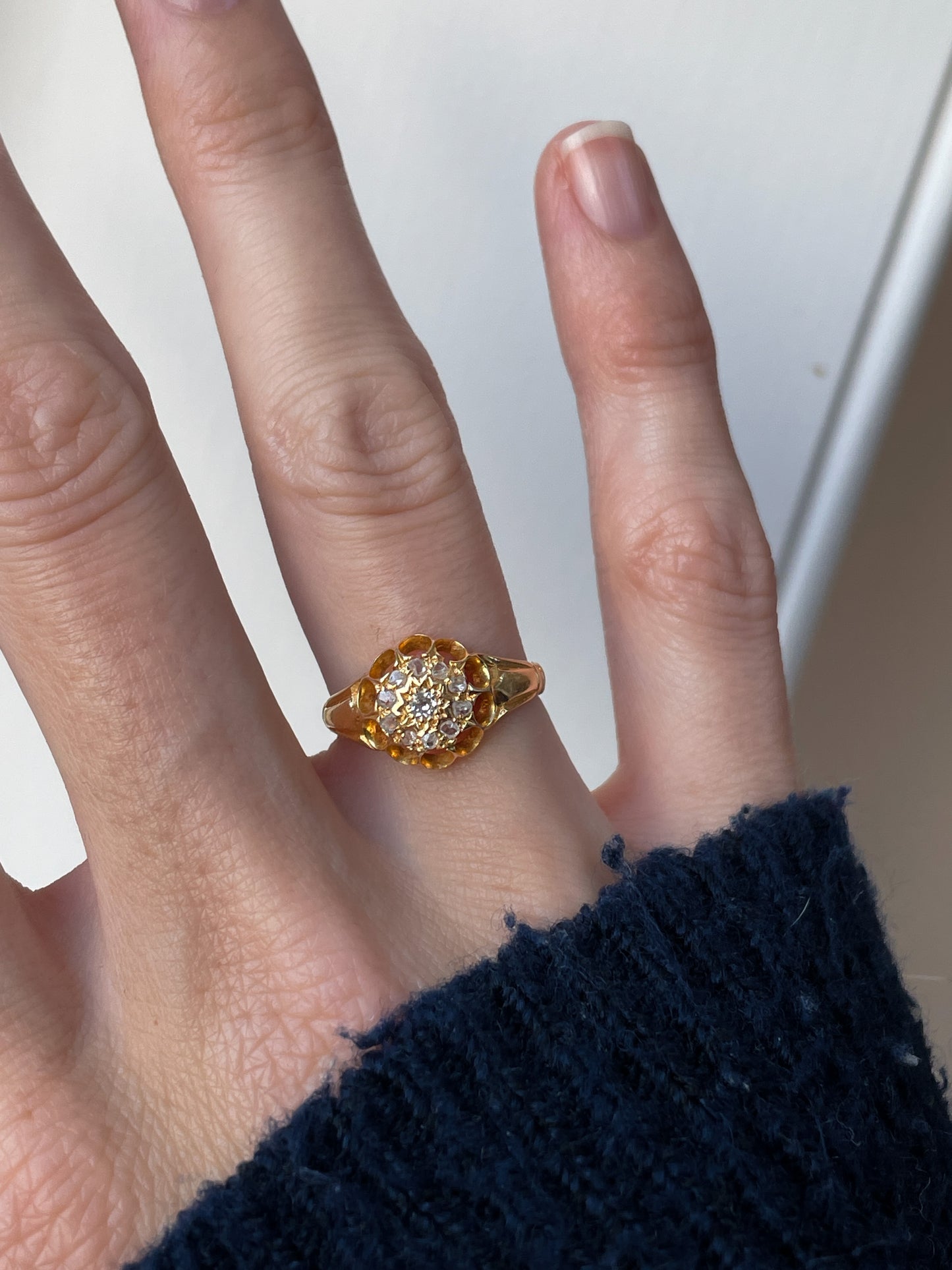 Antique diamond starburst halo ring on 18ct gold