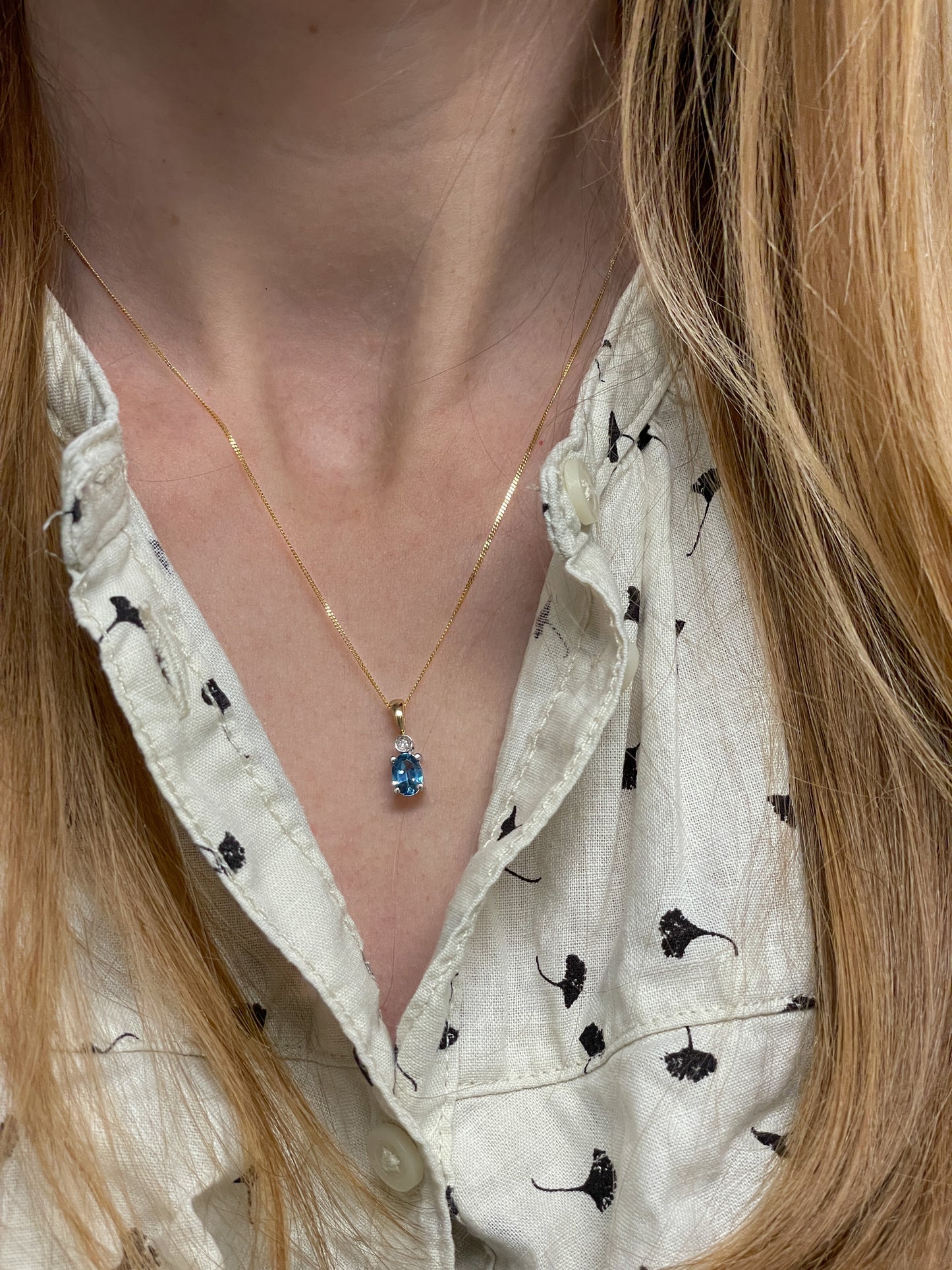 Blue topaz and diamond necklace