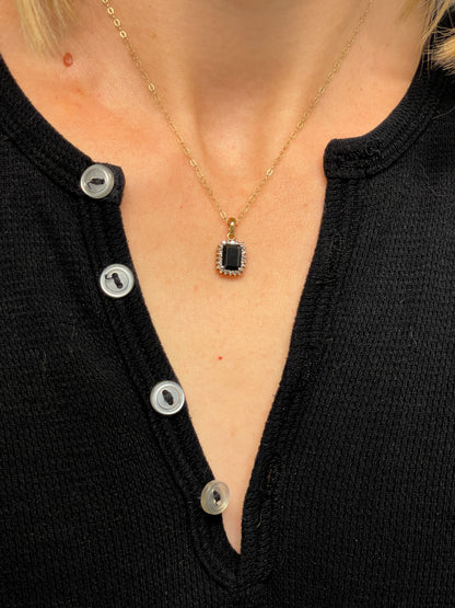 Vintage 1.25ct sapphire and diamond halo pendant with 9ct gold chain