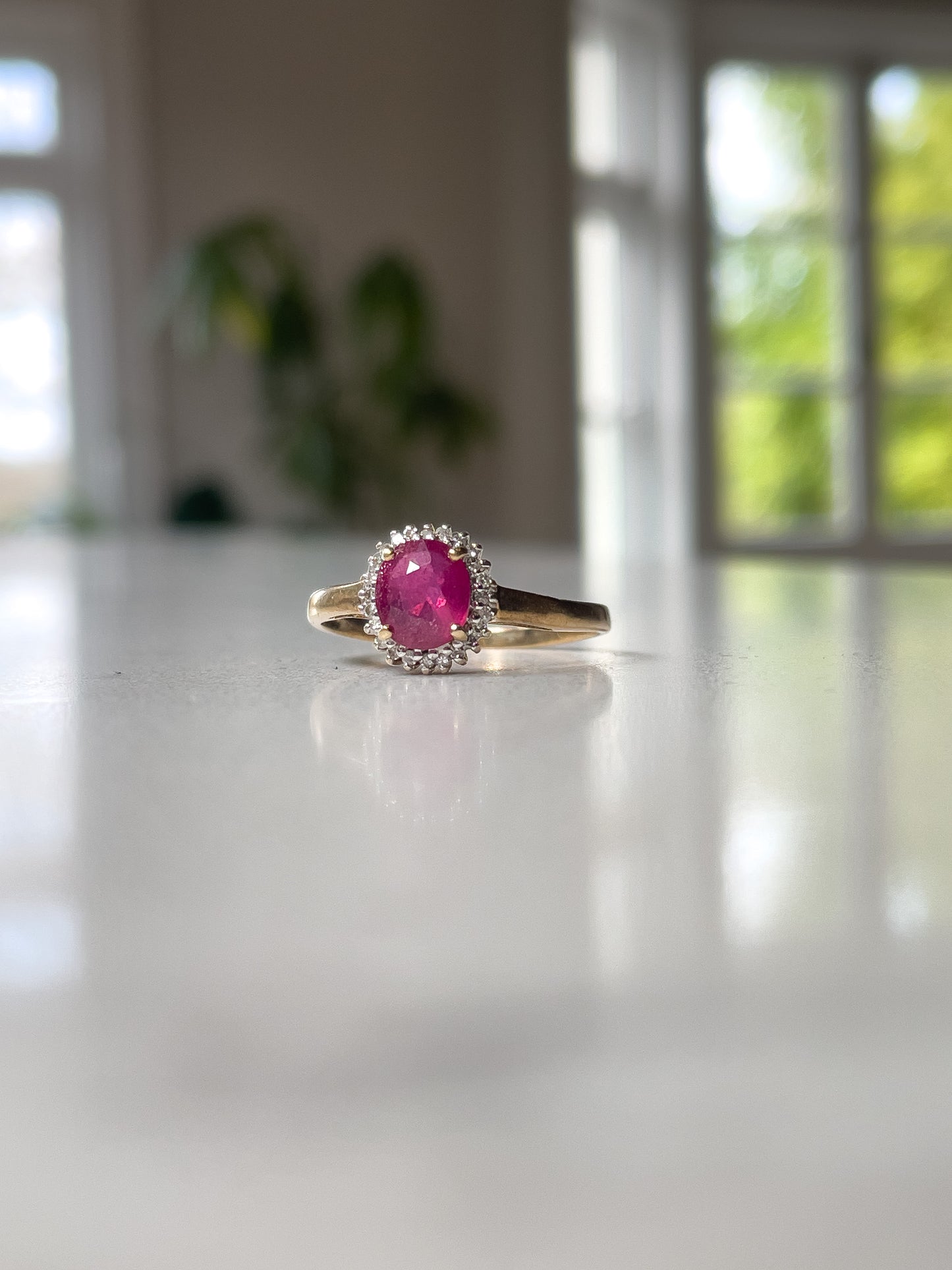Vintage ruby and diamond halo cluster ring on 9ct gold