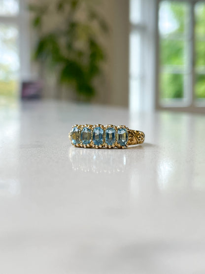 Vintage blue topaz half hoop ring on 9ct gold