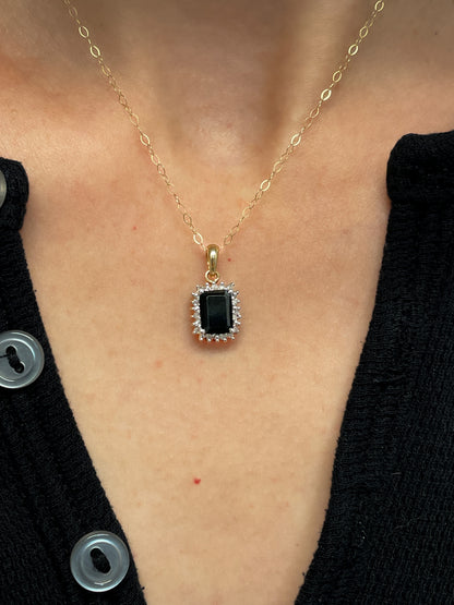 Vintage 1.25ct sapphire and diamond halo pendant with 9ct gold chain