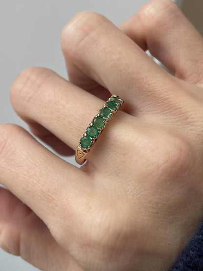 Vintage 7-stone emerald half eternity ring on 9ct gold
