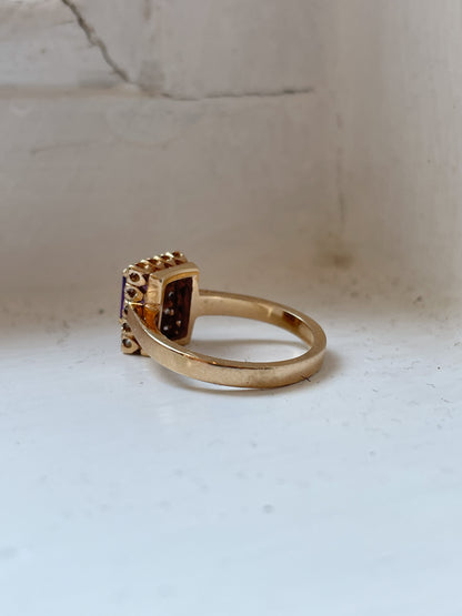 Vintage amethyst and diamond halo ring on 9ct gold