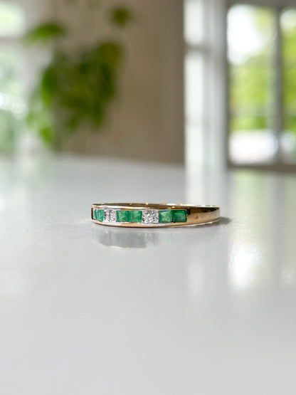 Vintage emerald and diamond half eternity ring