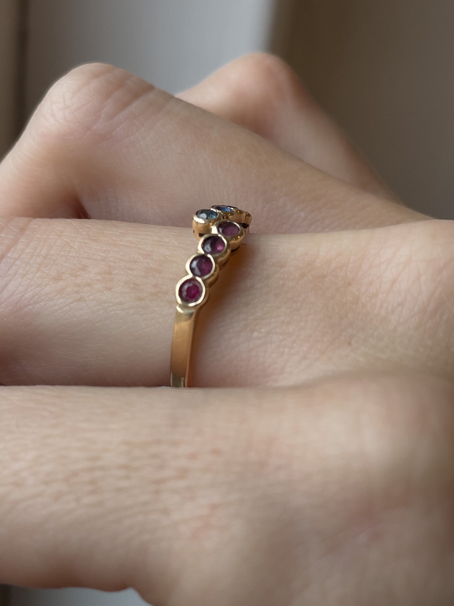 Vintage 8-stone sapphire and ruby bypass ring on 9ct gold