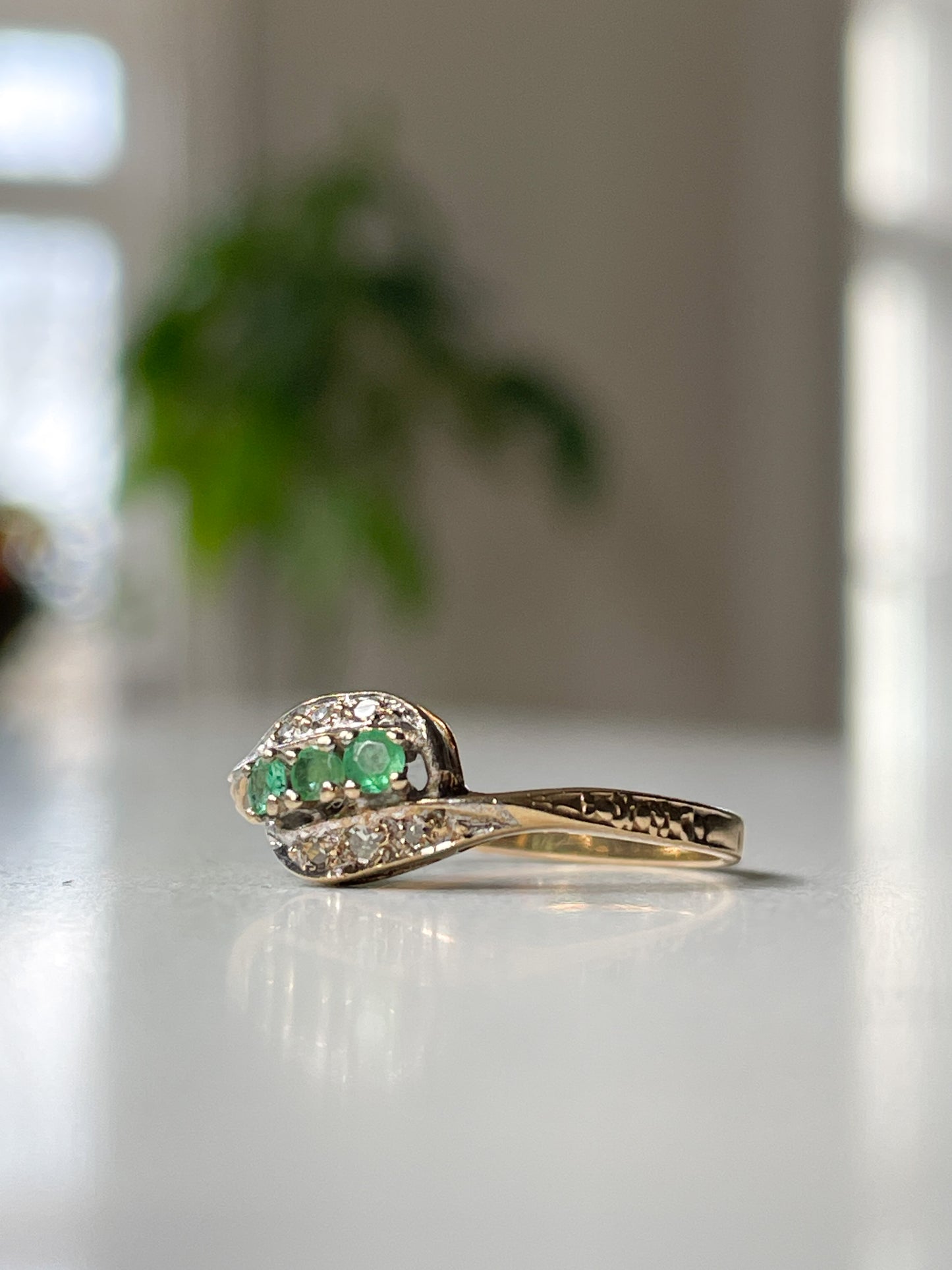 9ct gold emerald and diamond bypass ring from 1982