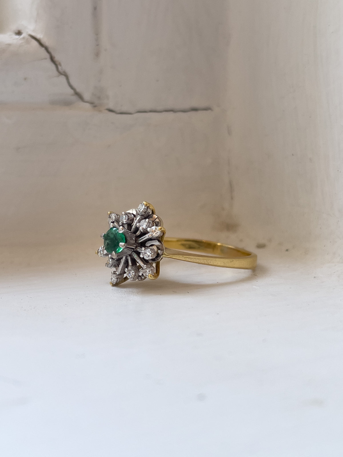 Vintage emerald and diamond snowflake cluster ring on 18ct gold