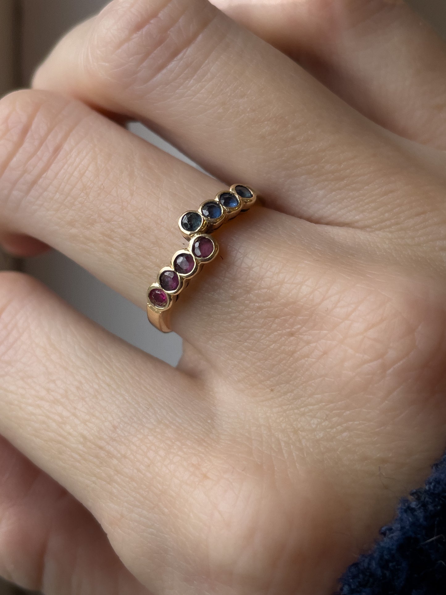 Vintage 8-stone sapphire and ruby bypass ring on 9ct gold