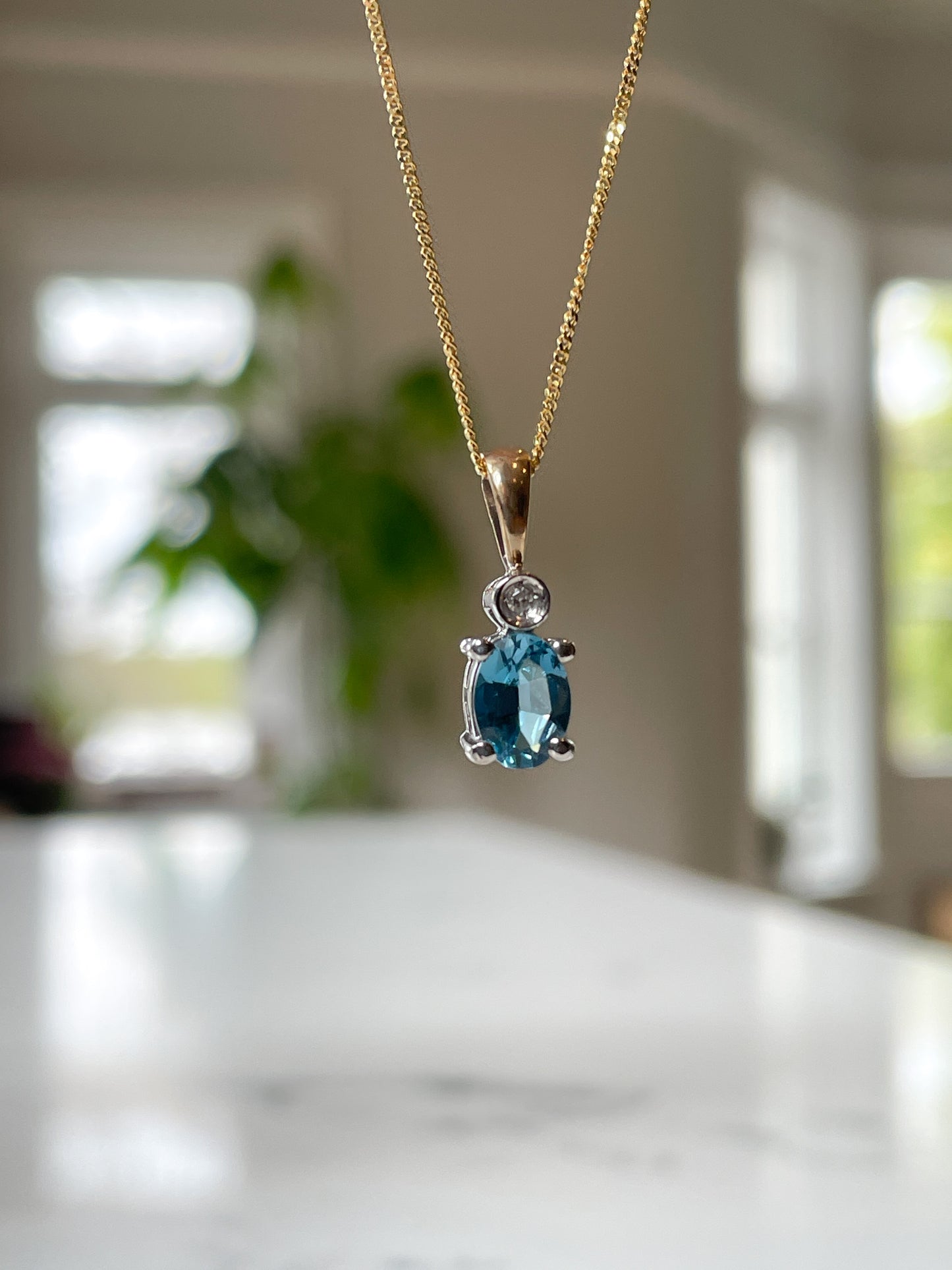 Blue topaz and diamond necklace